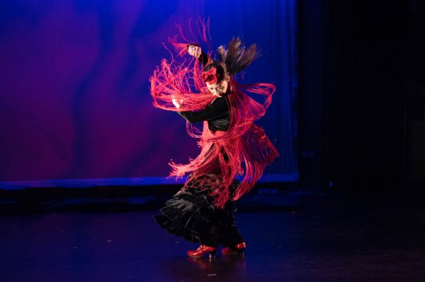 A dancer spinning on stage of LeFevre Theatre