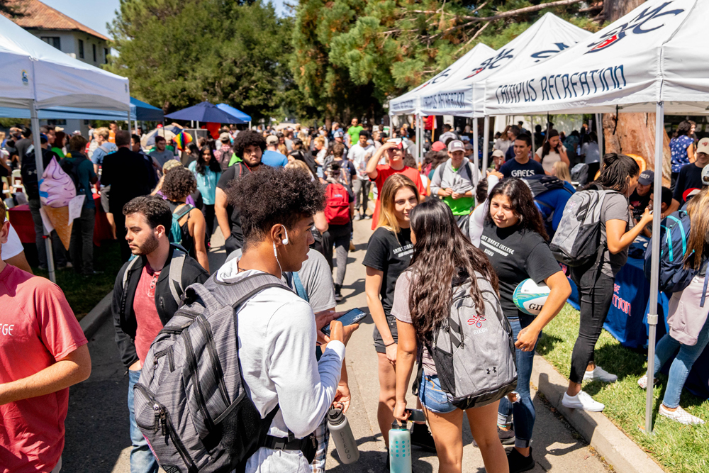 Tents with students walking between them