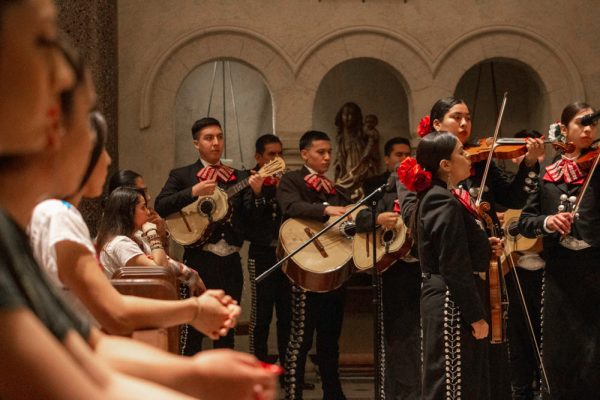 A mariachi band playing in the chapel during mass