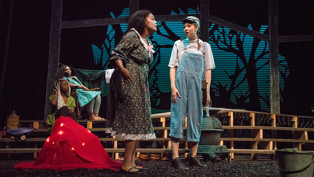 Actors on stage during a performance in Le Fevre Theatre